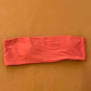 Burnt orange strapless bikini top. Removable pads. Never worn.